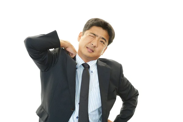 Tired and stressed Asian businessman — Stock Photo, Image