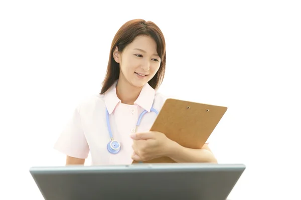 Smiling Asian female nurse — Stock Photo, Image