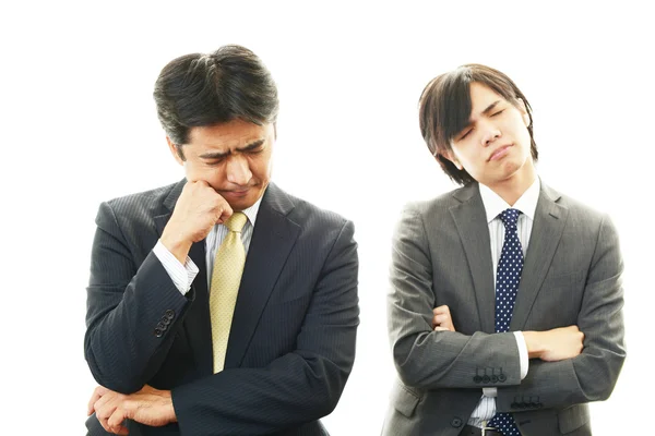 Stressed Asian businessmen — Stock Photo, Image