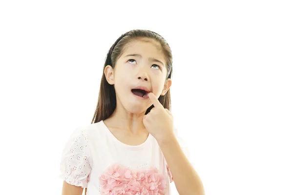 Asiatico ragazza sorriso avendo un mal di denti Foto Stock