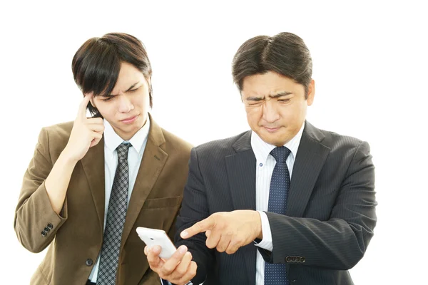 Stressed Asian businessmen — Stock Photo, Image