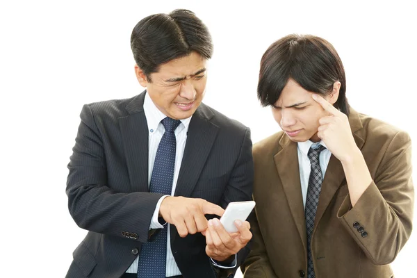 Stressed Asian businessmen — Stock Photo, Image