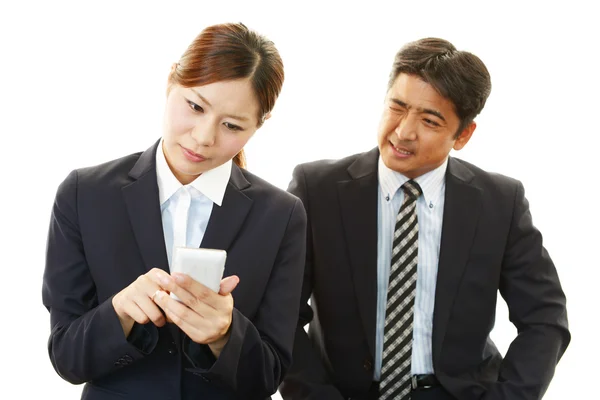 Businessman and businesswoman in the office — Stock Photo, Image