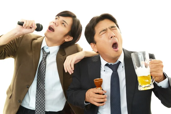 Drinking businessman — Stock Photo, Image
