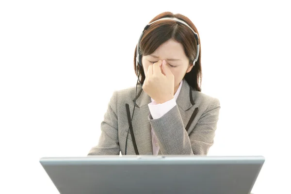 Tired telephone operator — Stock Photo, Image