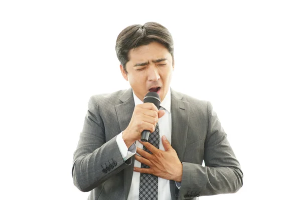 Homem segurando microfone — Fotografia de Stock