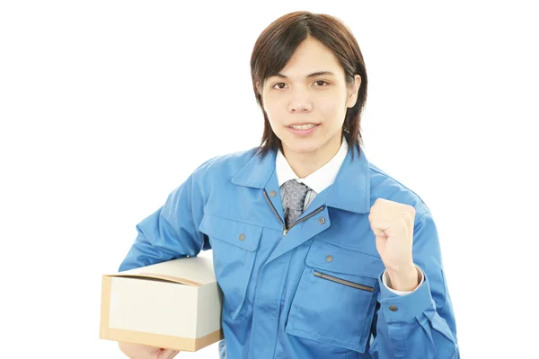 Asian courier delivering a package — Stock Photo, Image