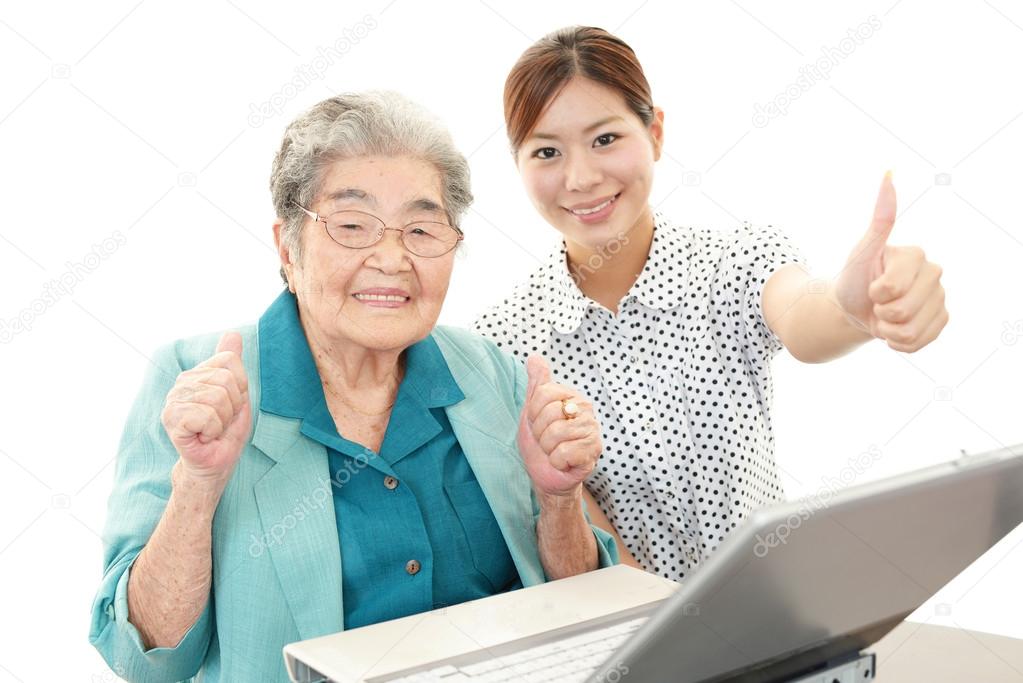 Old woman enjoys computer