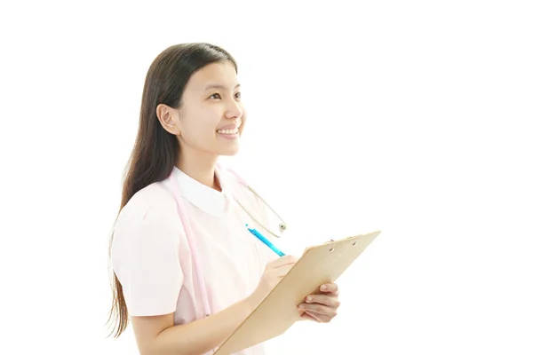 Sorridente asiatica infermiera femminile — Foto Stock