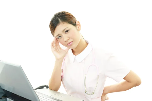 Verpleegster met een hoofdpijn — Stockfoto