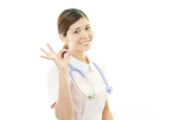 Ázsiai női ápoló mosolygó — Stock Fotó