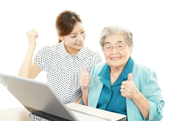 Smiling old woman and a teacher — Stock Photo, Image