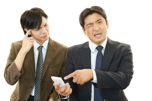 Stressed Asian businessmen — Stock Photo, Image