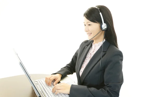 Smiling call center operator — Stock Photo, Image