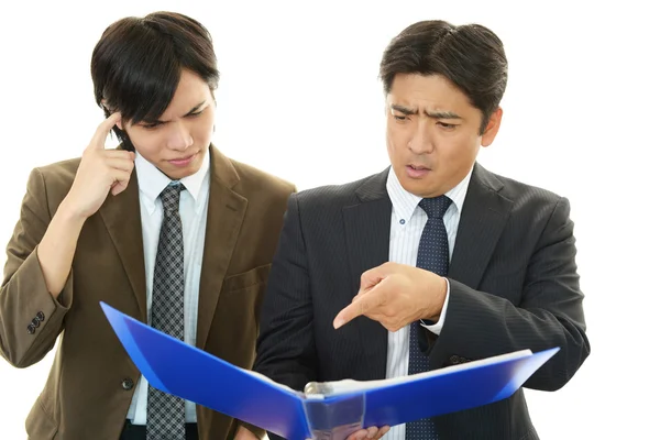 Stressed Asian businessmen — Stock Photo, Image