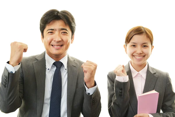 Smiling businessman and businesswomen — Stock Photo, Image