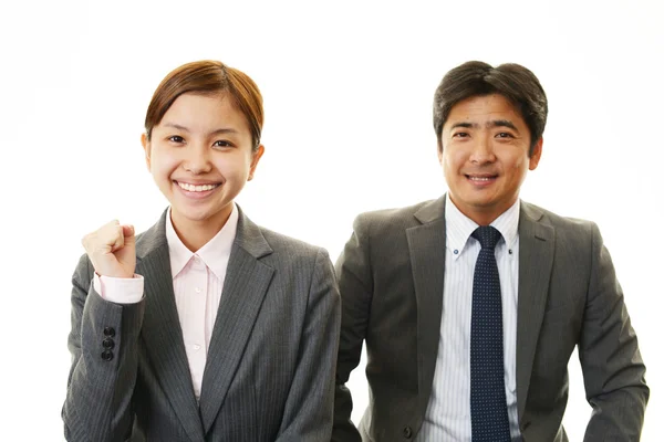 Smiling businessman and businesswomen — Stock Photo, Image