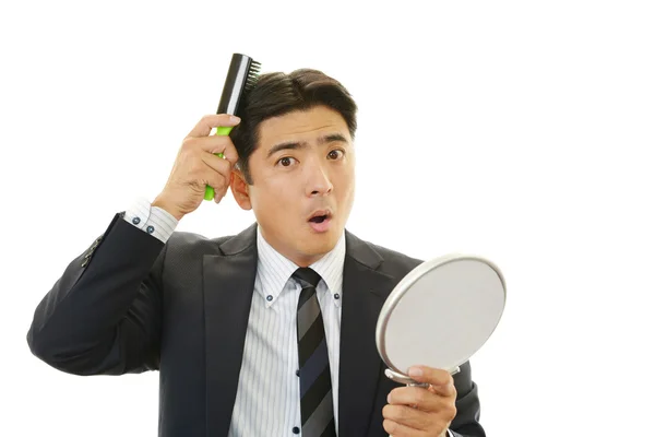 Man combing his hair — Stock Photo, Image