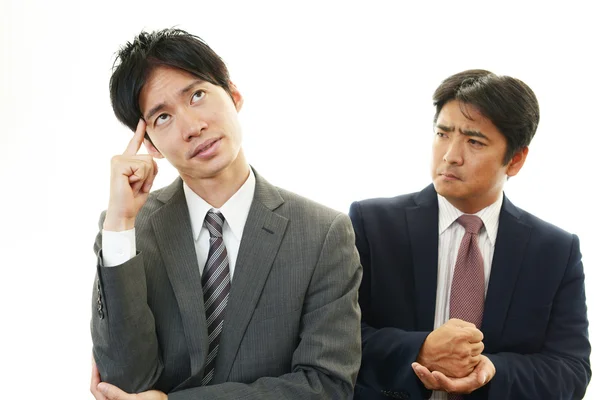 Stressed Asian businessmen — Stock Photo, Image
