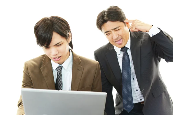 Stressed Asian businessmen Stock Picture