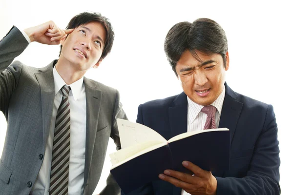 Stressed Asian businessmen — Stock Photo, Image