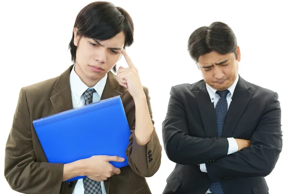 Stressed Asian businessmen — Stock Photo, Image