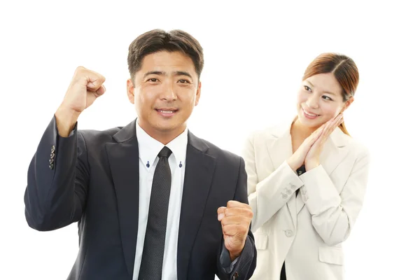 Hombre de negocios sonriente y mujeres de negocios — Foto de Stock