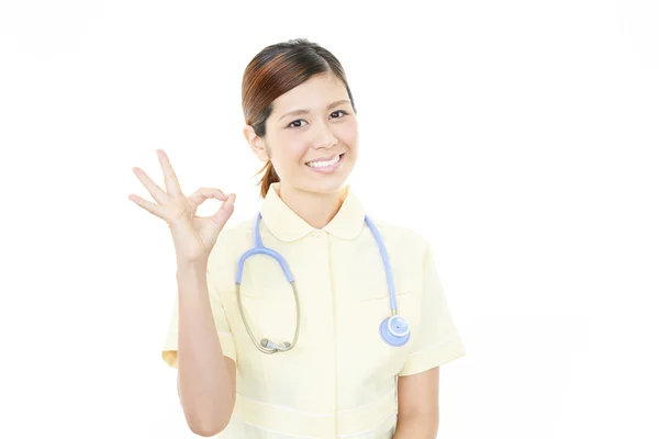 Sorridente asiatica infermiera femminile — Foto Stock