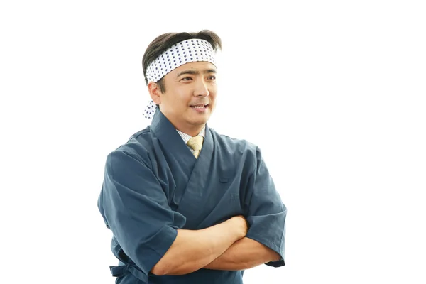 Japanese chef with a plate of sushi — Stock Photo, Image