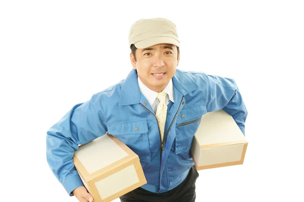 Asian courier delivering a package — Stock Photo, Image