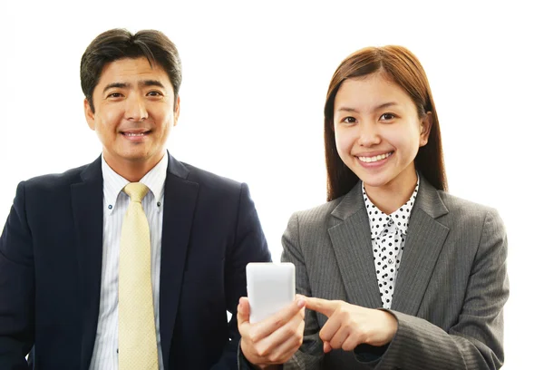 Smiling businessman and businesswomen — Stock Photo, Image