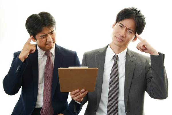 Stressed Asian businessmen — Stock Photo, Image