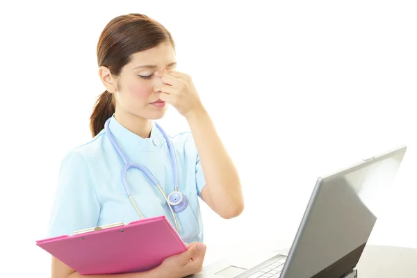 Depressed Asian female nurse — Stock Photo, Image