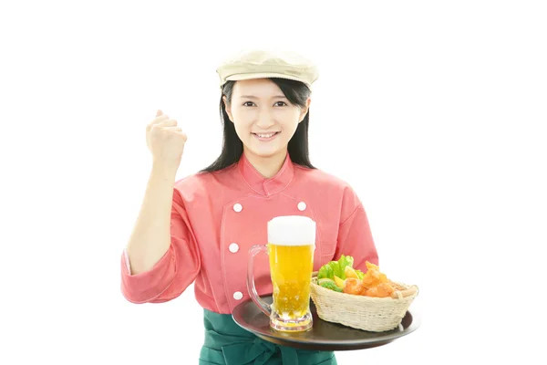 Waitress delivering meals to table — Stock Photo, Image