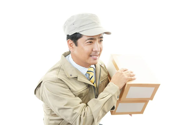 Asian courier delivering a package — Stock Photo, Image