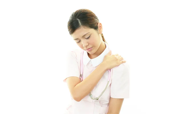 Nurse with shoulder pain. — Stock Photo, Image