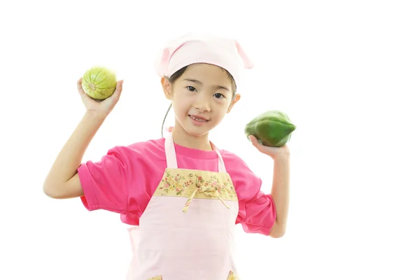 Chica sosteniendo frutas — Foto de Stock