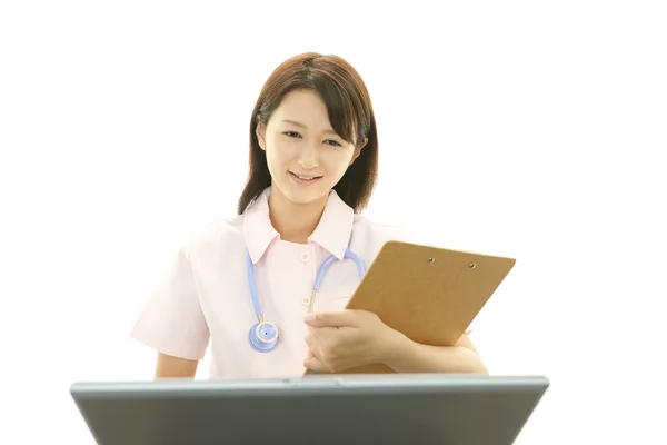 Smiling Asian female nurse — Stock Photo, Image