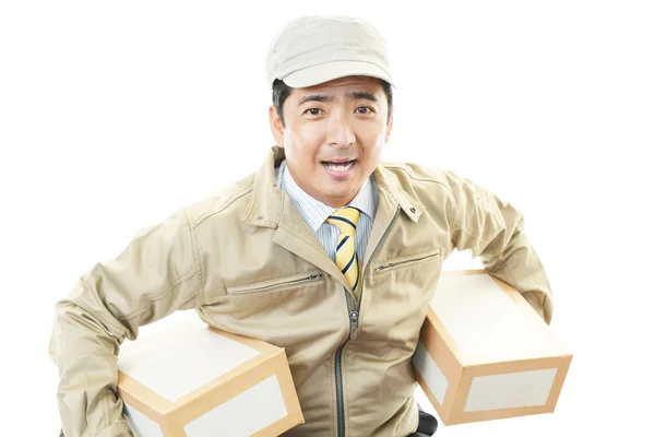 Asian courier delivering a package — Stock Photo, Image