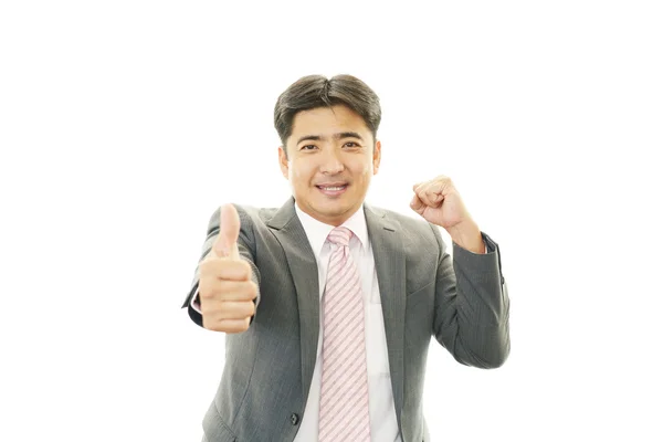 Feliz hombre de negocios mostrando pulgares hacia arriba signo —  Fotos de Stock