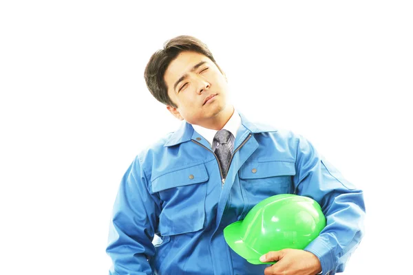 Tired and stressed Asian worker — Stock Photo, Image