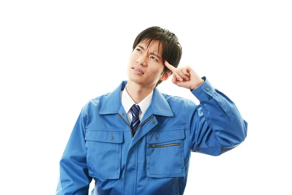 Tired and stressed Asian worker — Stock Photo, Image