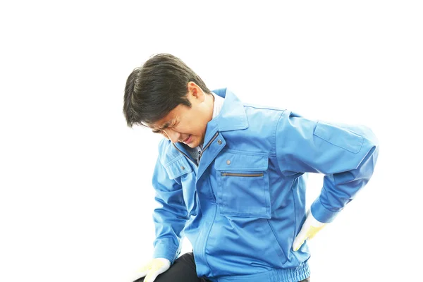 Tired and stressed Asian worker — Stock Photo, Image