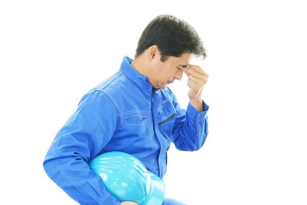 Tired and stressed Asian worker — Stock Photo, Image