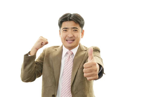 Happy business man showing thumbs up sign — Stock Photo, Image