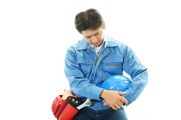 Tired and stressed Asian construction worker — Stock Photo, Image