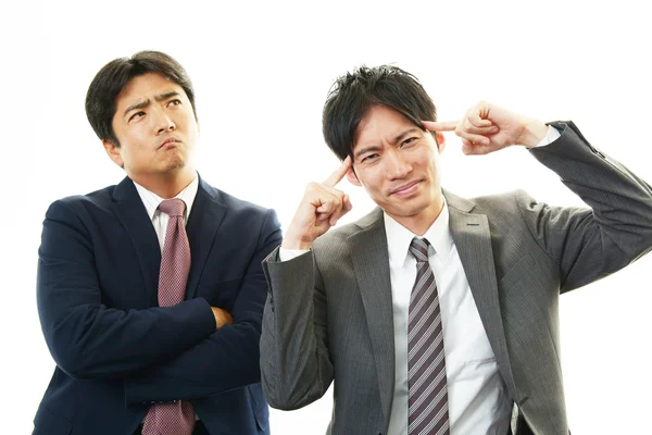 Stressed Asian businessmen — Stock Photo, Image