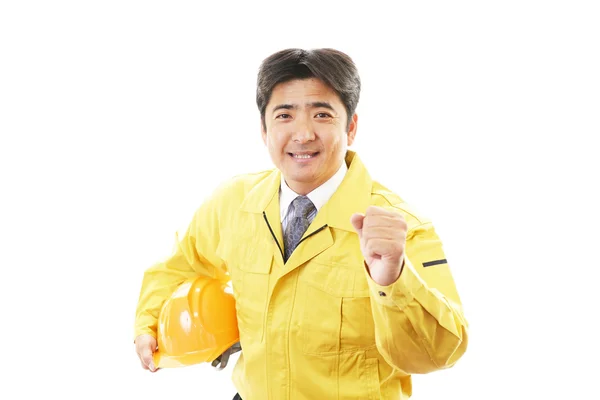 Lächelnder Bauarbeiter — Stockfoto