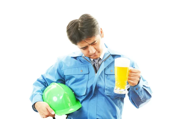 Asian worker drinking beer — Stock Photo, Image