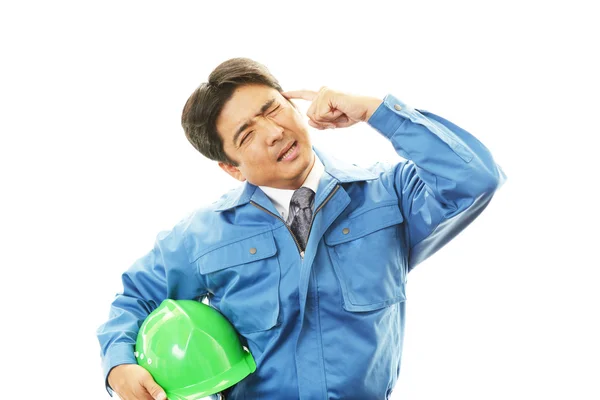 Müde und gestresste asiatische Arbeiter — Stockfoto